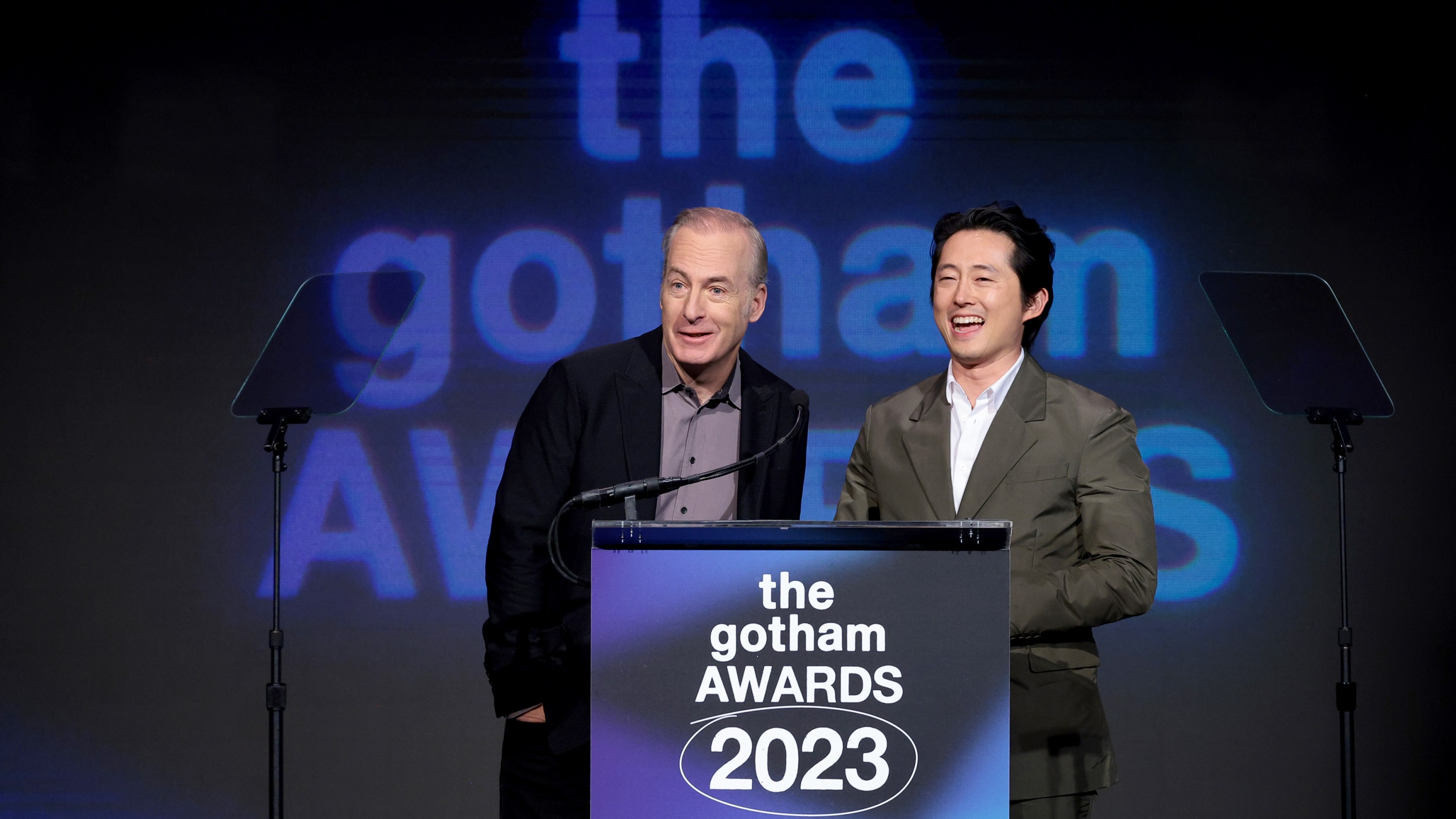 NEW YORK, NEW YORK - NOVEMBER 27: Bob Odenkirk and Steven Yeun speak onstage at The 2023 Gotham Awards  at Cipriani Wall Street on November 27, 2023 in New York City. (Photo by Dimitrios Kambouris/Getty Images for The Gotham Film & Media Institute)