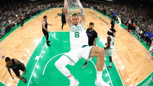 BOSTON, MASSACHUSETTS - JUNE 06: Kristaps Porzingis #8 of the Boston Celtics dunks the ball during the first quarter against the Dallas Mavericks in Game One of the 2024 NBA Finals at TD Garden on June 06, 2024 in Boston, Massachusetts. NOTE TO USER: User expressly acknowledges and agrees that, by downloading and or using this photograph, User is consenting to the terms and conditions of the Getty Images License Agreement. (Photo by Maddie Meyer/Getty Images)