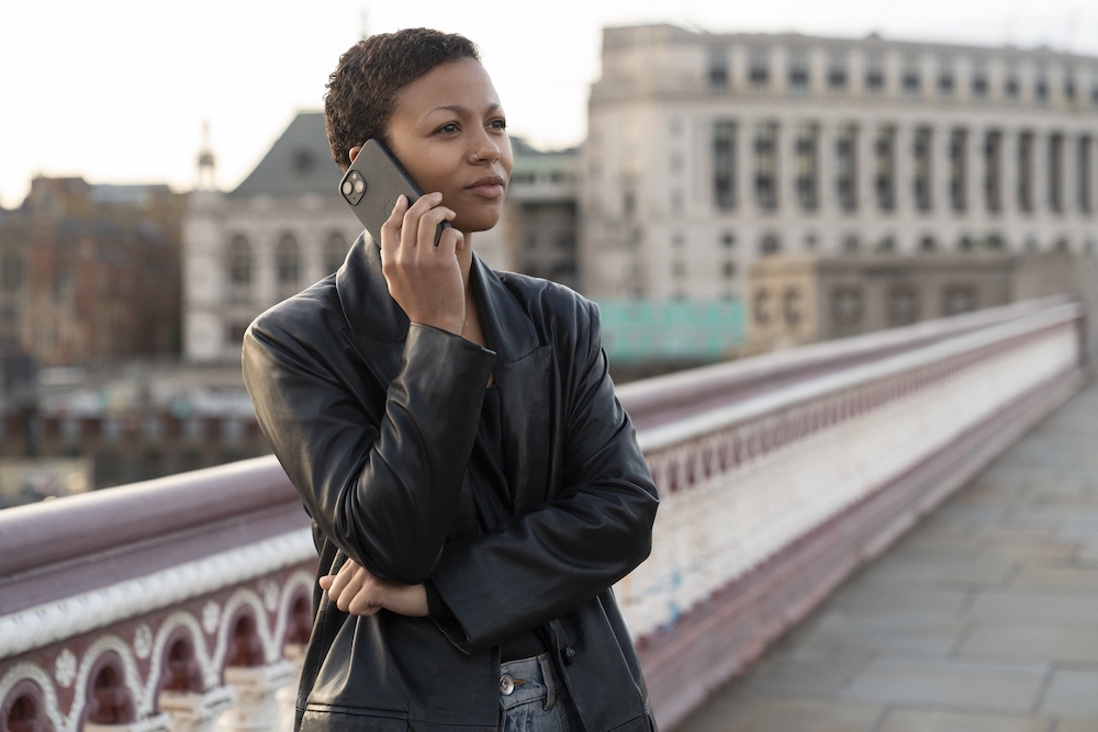 Industry Season 3 stars Myha'la as Harper, shown here standing on a bridge on the phone