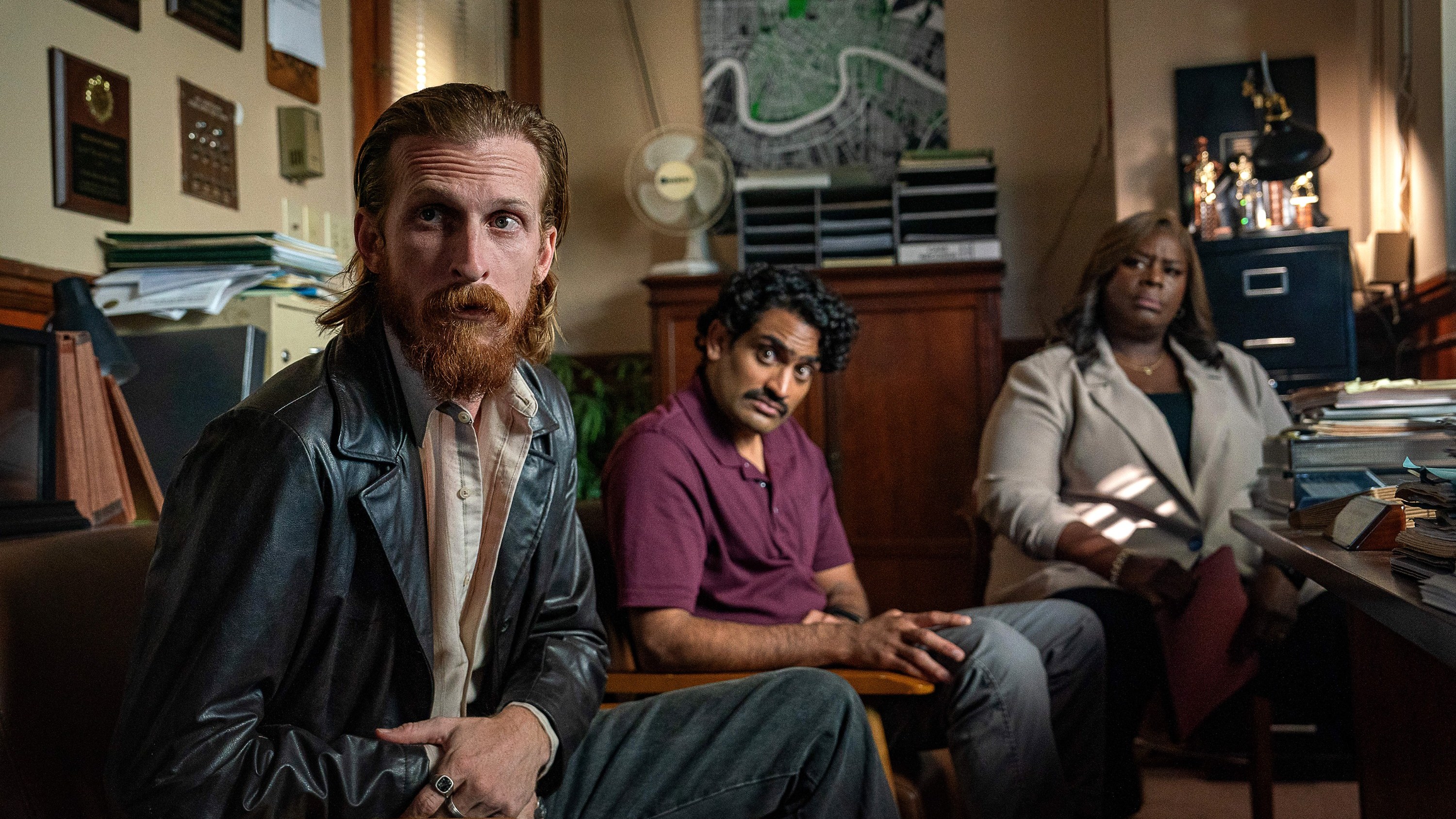 'Hit Man' from left: Austin Amelio, Sanjay Rao, Retta, 2023. ph: Brian Roedel / © Netflix / courtesy Everett Collection