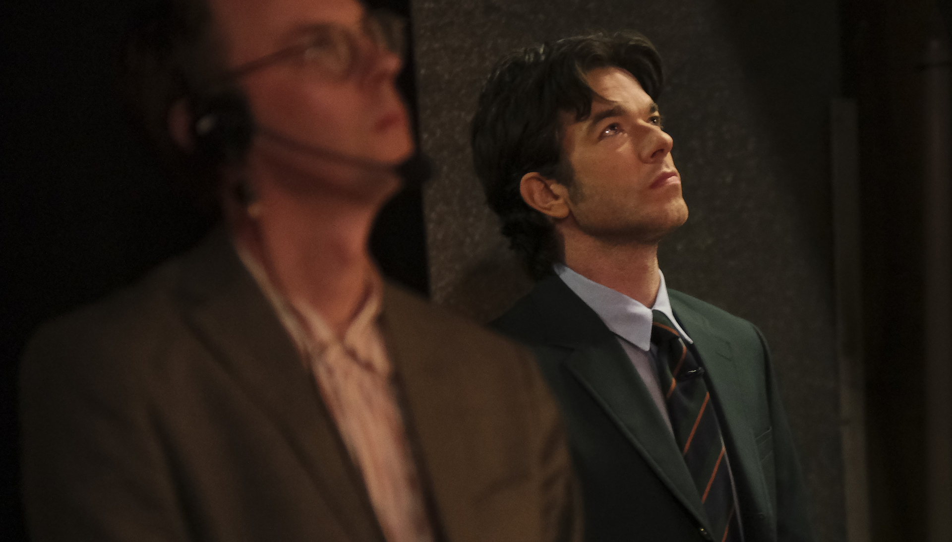 John Mulaney wearing a suit and looking up, backstage at 'Everybody's in LA'