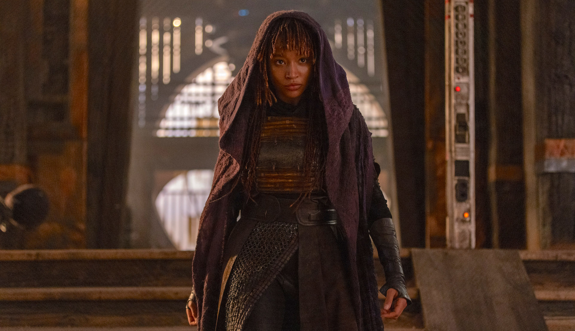 Actor Amandla Stenberg wearing a cloak as Mae in 'The Acolyte'