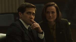 'Presumed Innocent' stars Jake Gyllenhaal as Rusty Savage and Renate Reinsve as Carolyn Polhemus, shown here wearing suits, sitting together