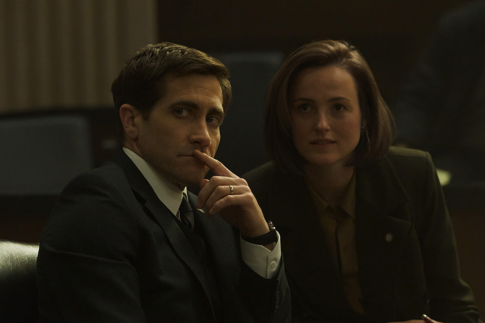 'Presumed Innocent' stars Jake Gyllenhaal as Rusty Savage and Renate Reinsve as Carolyn Polhemus, shown here wearing suits, sitting together